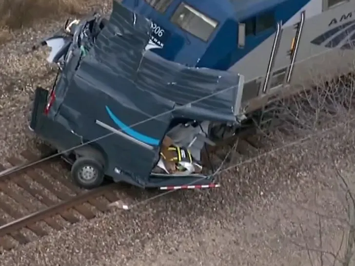 Train Spilts Amazon Van Into TWO