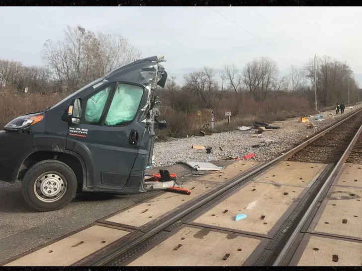 Train Spilts Amazon Van Into TWO